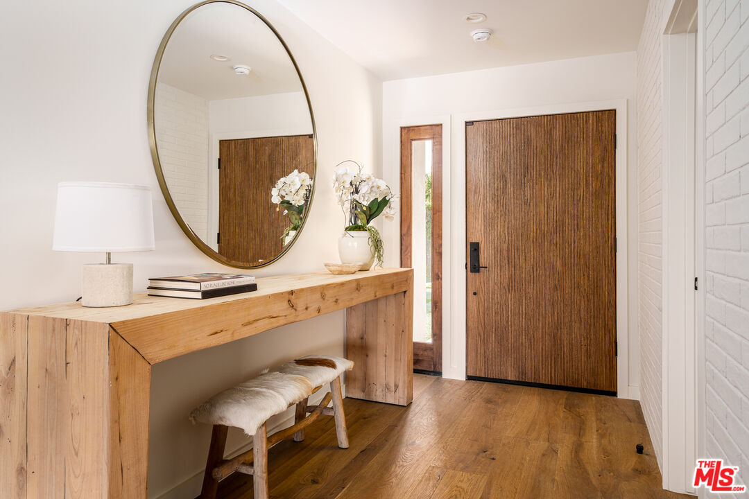 2658 Carmar Drive Los Angeles, CA 90046 - Photo 3 of 29 a view of a livingroom with furniture and a mirror
