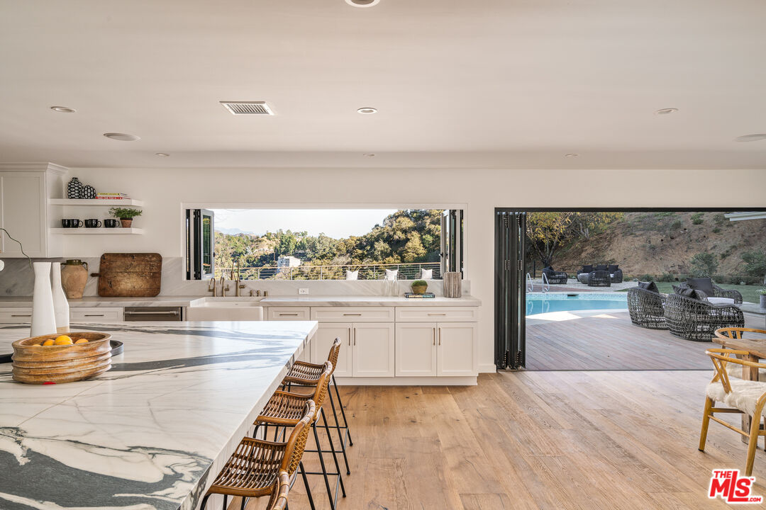 2658 Carmar Drive Los Angeles, CA 90046 - Photo 7 of 29 a living room with furniture and a floor to ceiling window