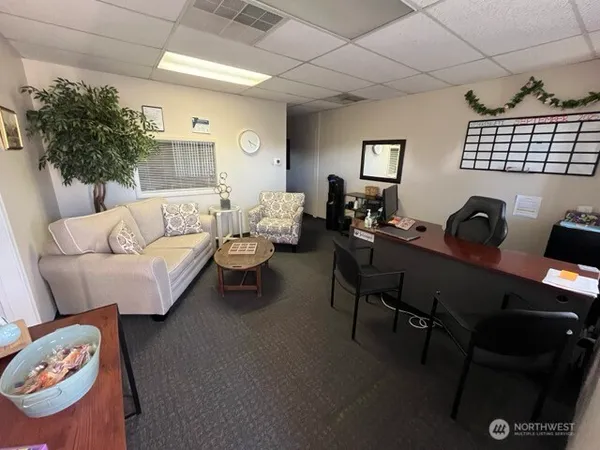 a living room with furniture and a window