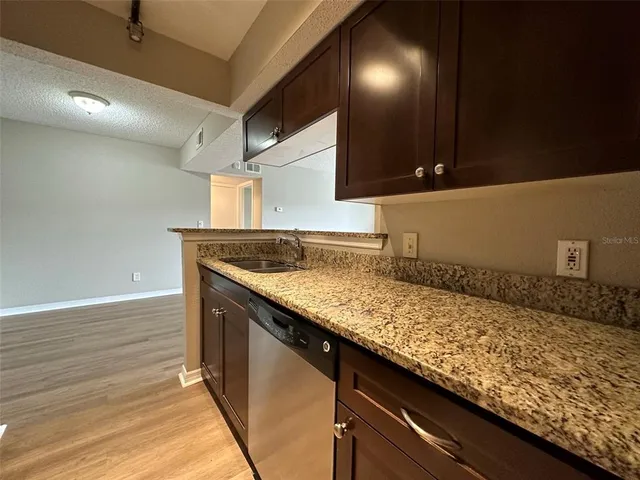 a kitchen with a sink and cabinets