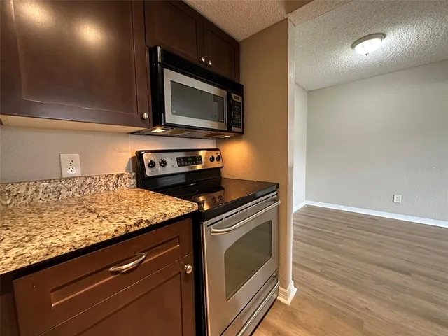 a kitchen with a stove and a microwave