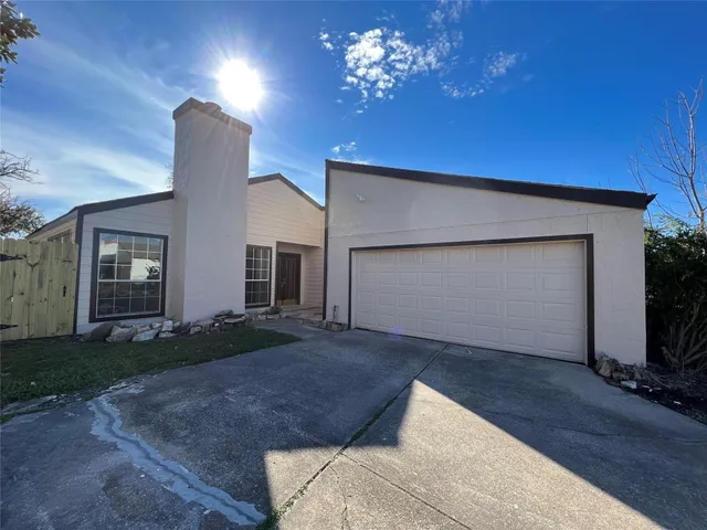 a view of a house with a garage