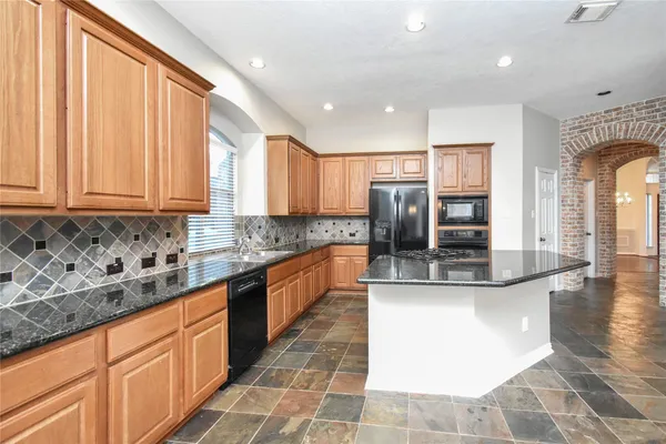 a view interior of a house and an entryway with wooden floor