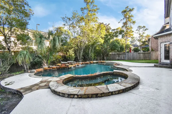 a view of a swimming pool with a patio