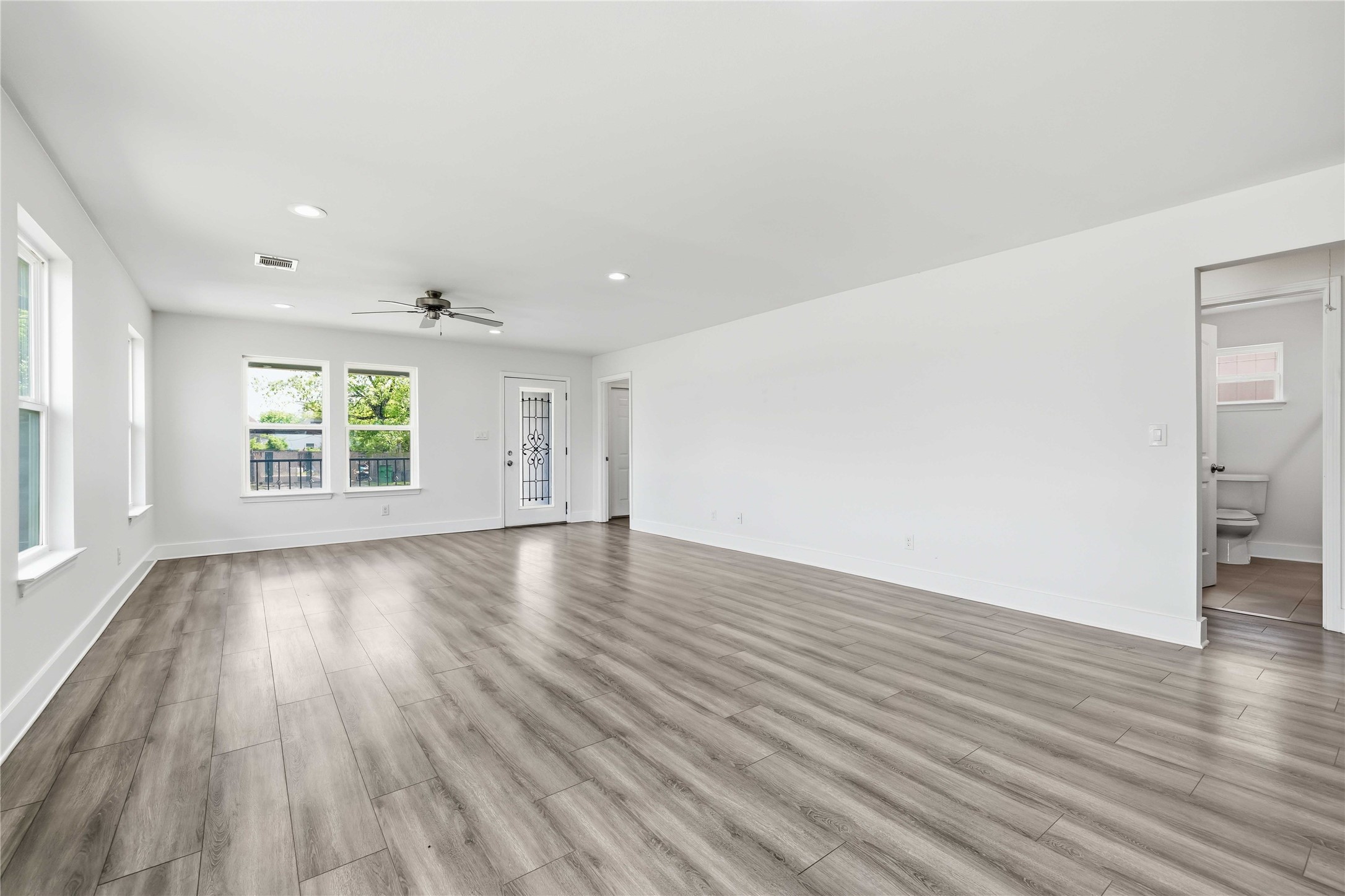 400 Booth Street Taylor, TX 76574 - Photo 10 of 35 Unfurnished living room with a ceiling fan, light wood-style floors, and recessed lighting