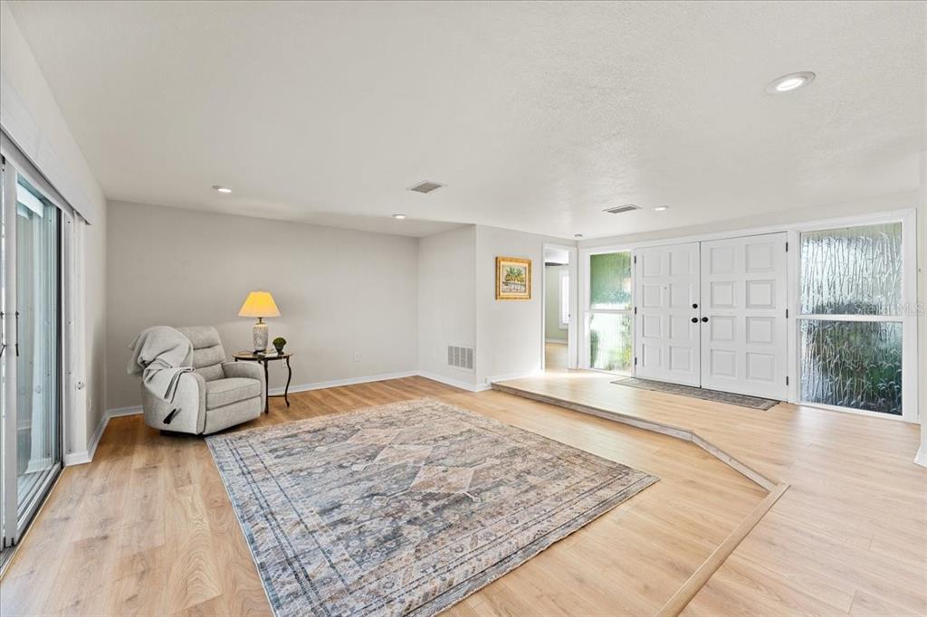 5028 Ensign Loop New Port Richey, FL 34652 - Photo 11 of 76 a bedroom with a bed and wooden floor