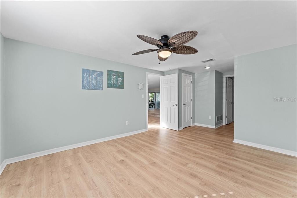 5028 Ensign Loop New Port Richey, FL 34652 - Photo 23 of 76 a view of an empty room with window and wooden floor