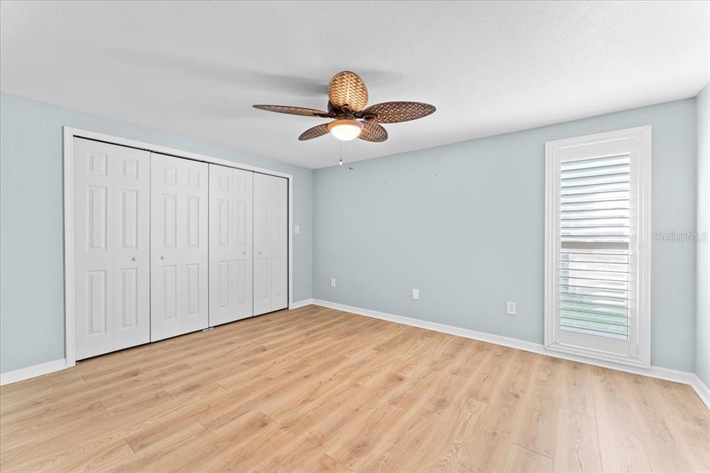 5028 Ensign Loop New Port Richey, FL 34652 - Photo 28 of 76 wooden floor in an empty room with a window