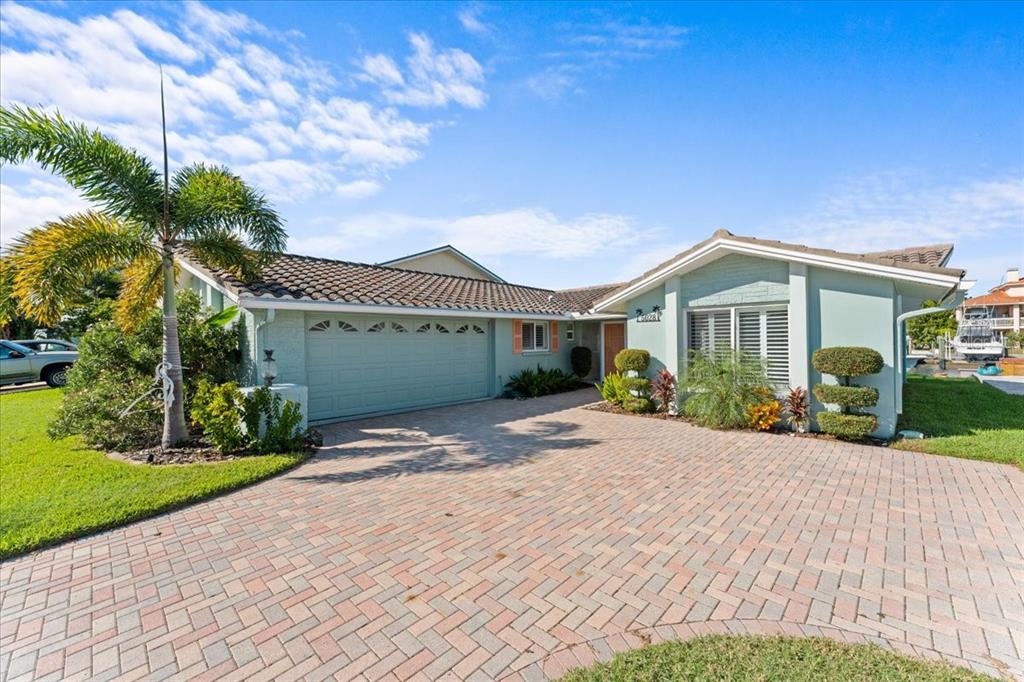 5028 Ensign Loop New Port Richey, FL 34652 - Photo 3 of 76 a view of front of house with a yard
