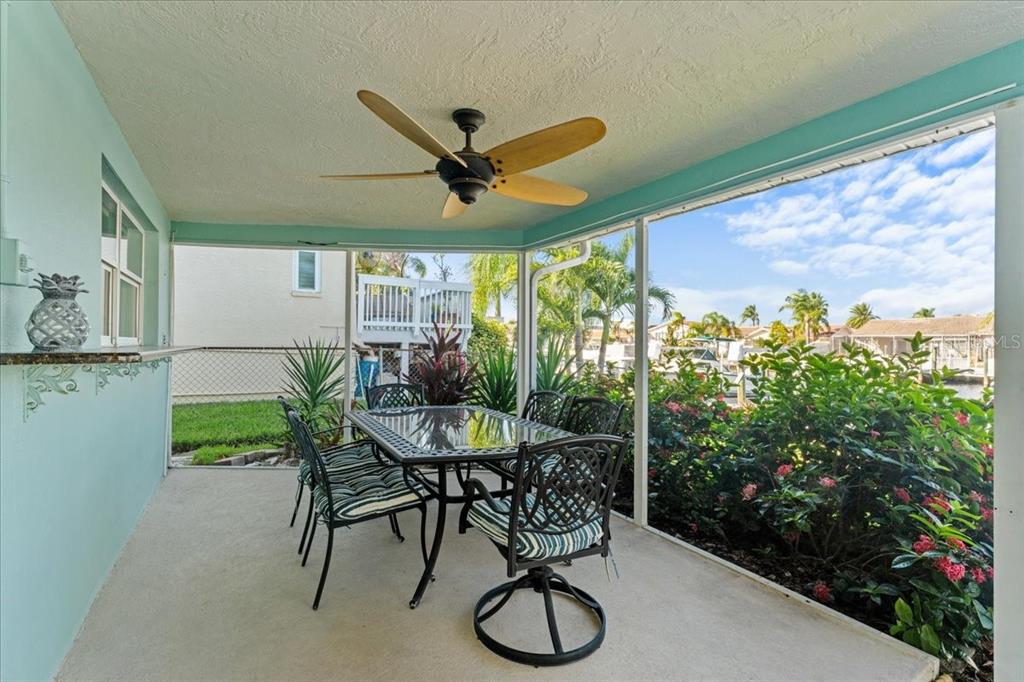5028 Ensign Loop New Port Richey, FL 34652 - Photo 37 of 76 a view of a chairs and table in a patio