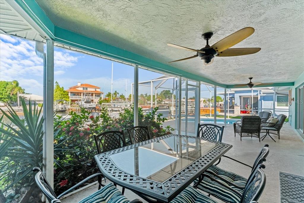 5028 Ensign Loop New Port Richey, FL 34652 - Photo 38 of 76 a view of a dining room with furniture window and outside view