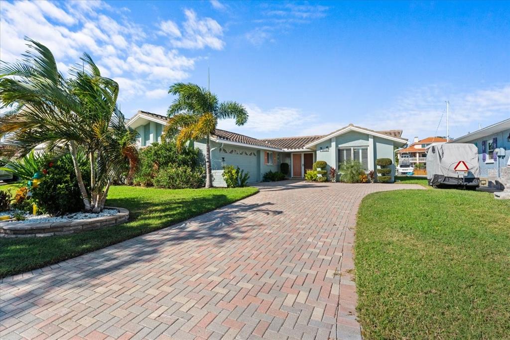 5028 Ensign Loop New Port Richey, FL 34652 - Photo 4 of 76 a front view of a house with a yard