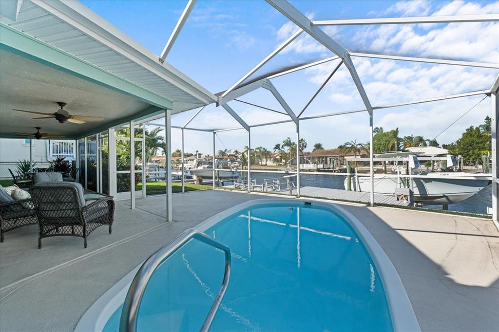 5028 Ensign Loop New Port Richey, FL 34652 - Photo 44 of 76 a view of a swimming pool with seating area