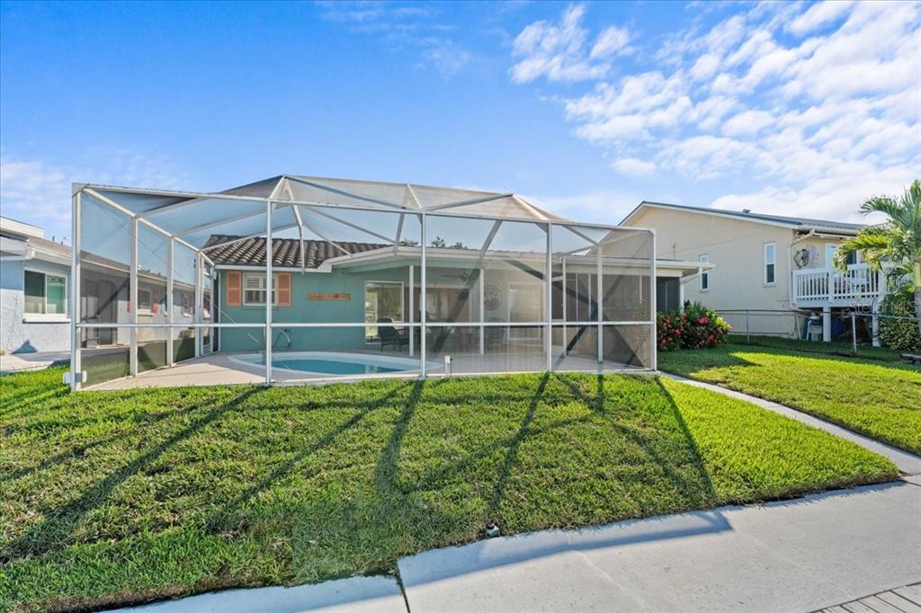 5028 Ensign Loop New Port Richey, FL 34652 - Photo 48 of 76 a view of a house with a yard