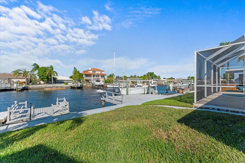 5028 Ensign Loop New Port Richey, FL 34652 - Photo 53 of 76 a swimming pool with outdoor seating and yard