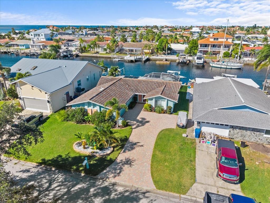 5028 Ensign Loop New Port Richey, FL 34652 - Photo 55 of 76 an aerial view of a house with a swimming pool yard and outdoor seating