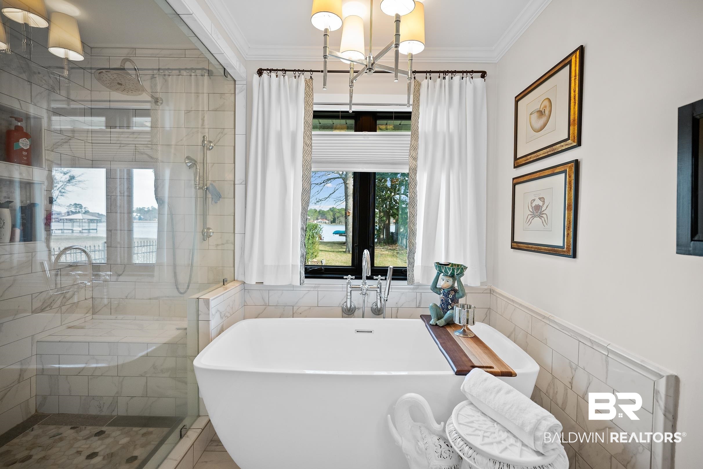 8490 Bay View Drive Foley, AL 36535 - Photo 41 of 67 Bathroom featuring a soaking tub, tile walls, ornamental molding, a chandelier, and tiled shower