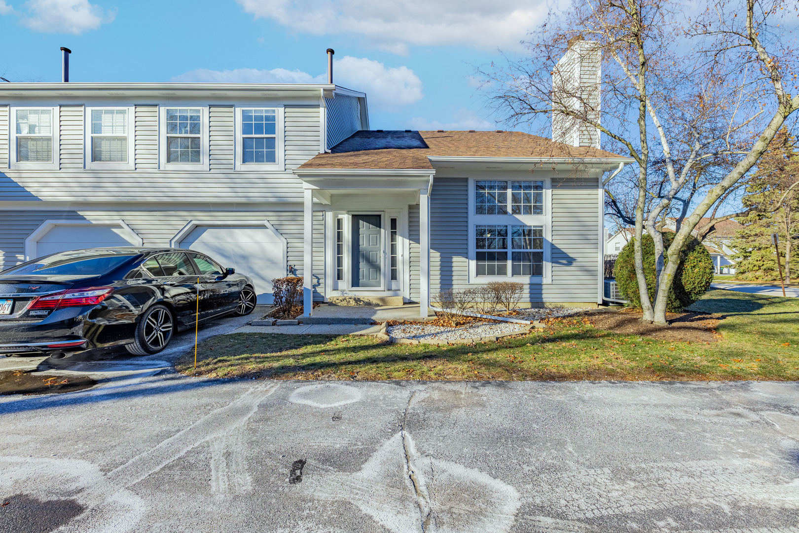 237 Acorn Drive Streamwood, IL 60107 - Photo 2 of 31 a view of a house with small yard and a car park in front of it