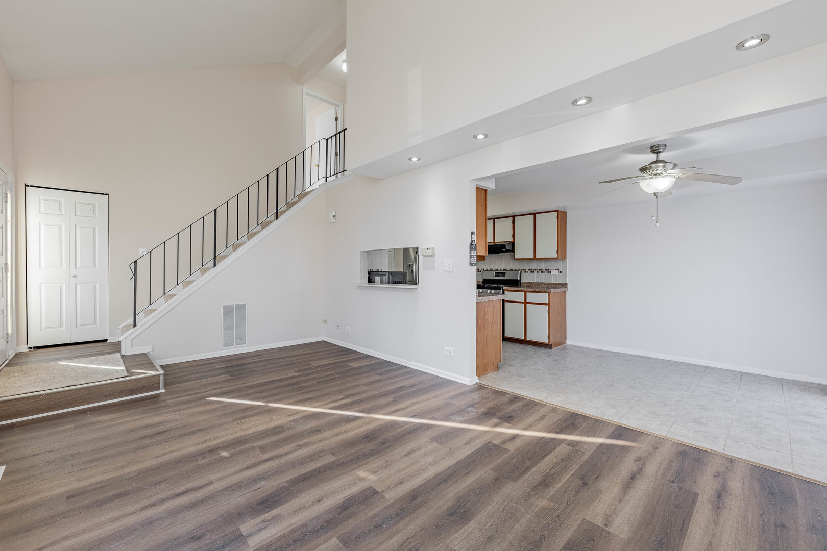 237 Acorn Drive Streamwood, IL 60107 - Photo 4 of 31 a view of a kitchen with wooden floor and electronic appliances