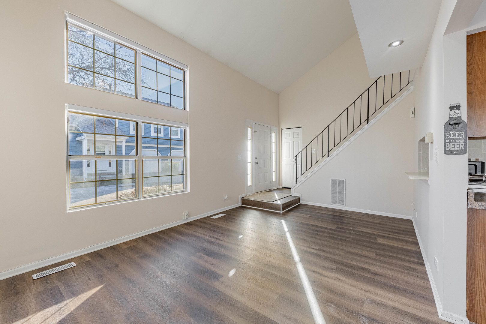 237 Acorn Drive Streamwood, IL 60107 - Photo 5 of 31 a view of an empty room with wooden floor and a window