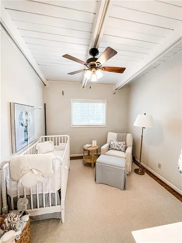 a bedroom with furniture and a chandelier