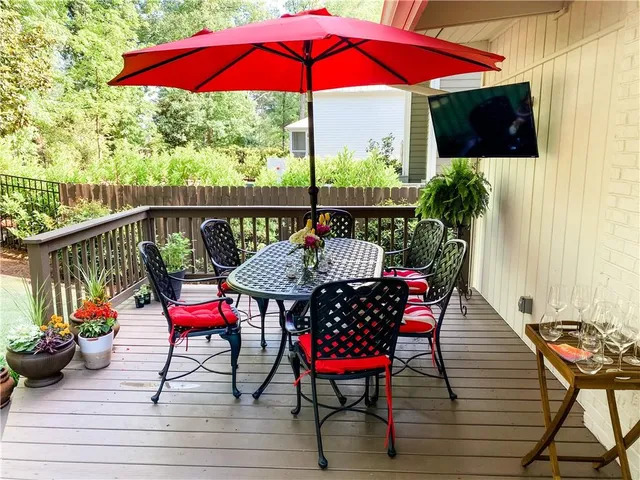a view of balcony with outdoor seating and wooden floor