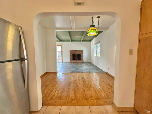 a view of an empty room with a window