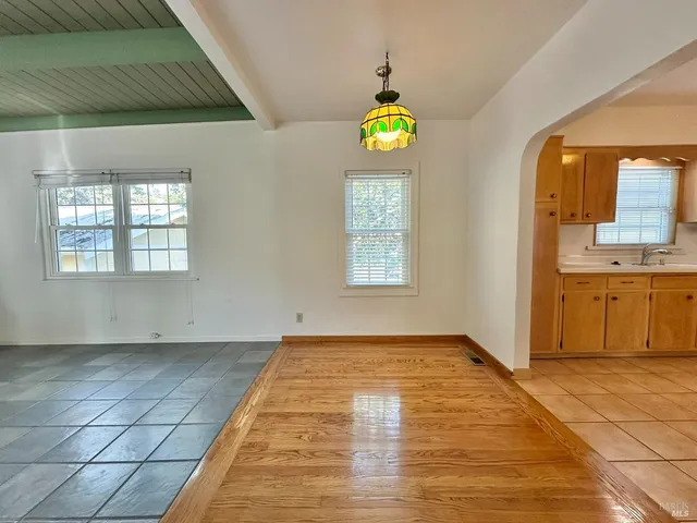 a view of an empty room with a fireplace