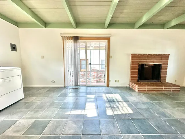 a bathroom with a bathtub and window