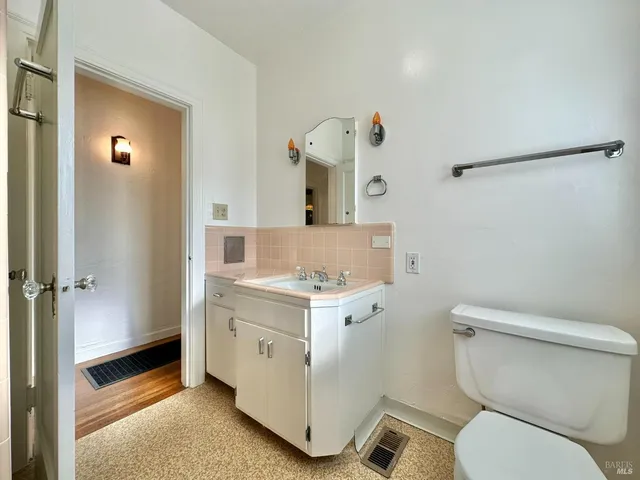 a living room with furniture and windows