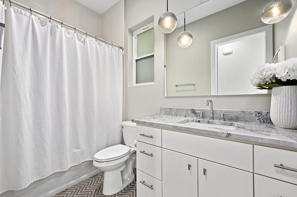 5212 Huisache Street, Unit 2 Austin, TX 78751 - Photo 18 of 30 Bathroom with shower / bath combo and vanity