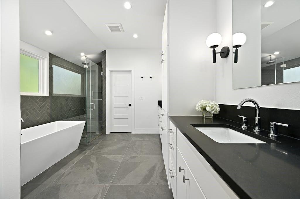 5212 Huisache Street, Unit 2 Austin, TX 78751 - Photo 20 of 30 Full bath featuring vanity, a stall shower, a soaking tub, and recessed lighting