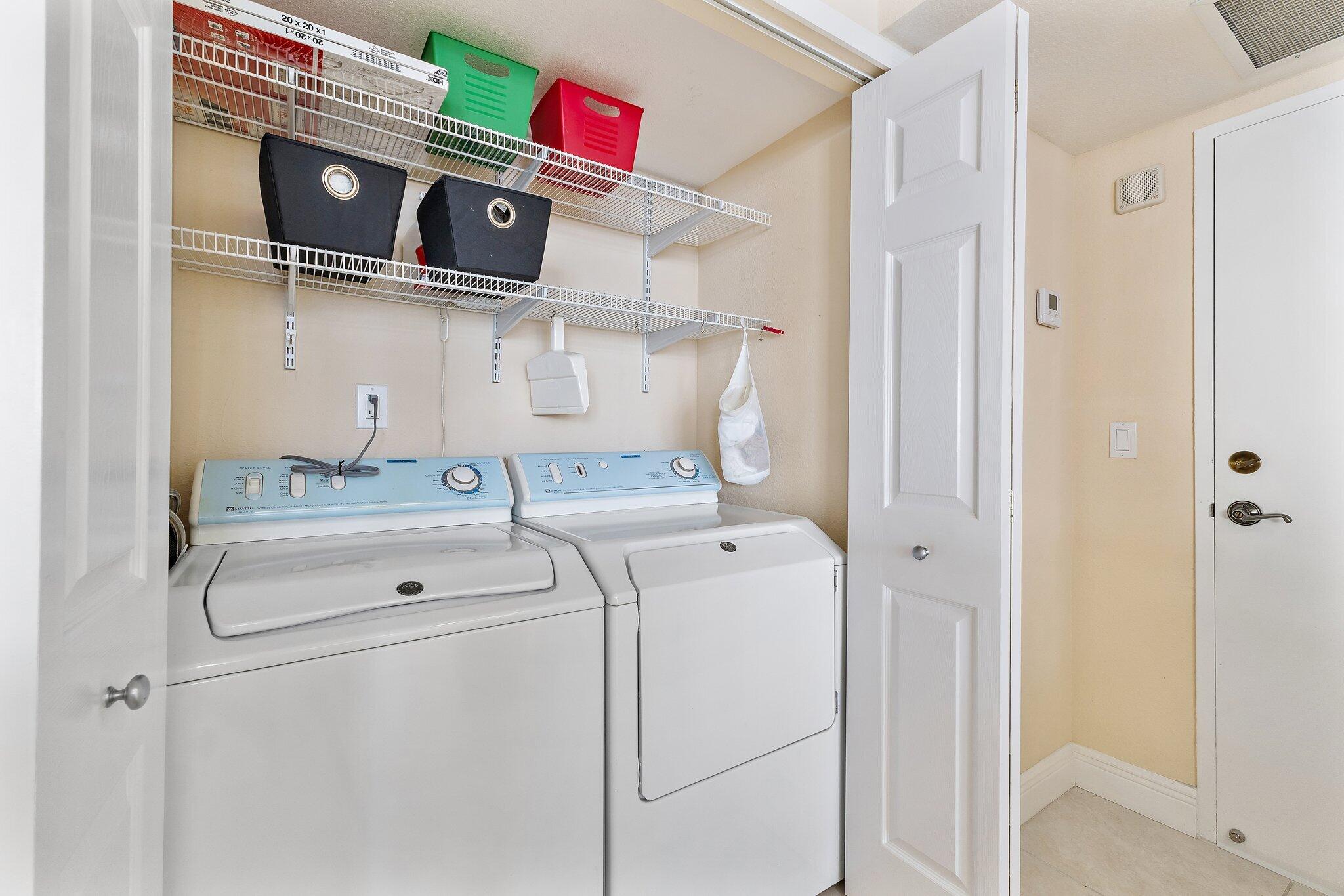 Undisclosed Address Singer Island, FL 33404 - Photo 21 of 77 a utility room with dryer and washer