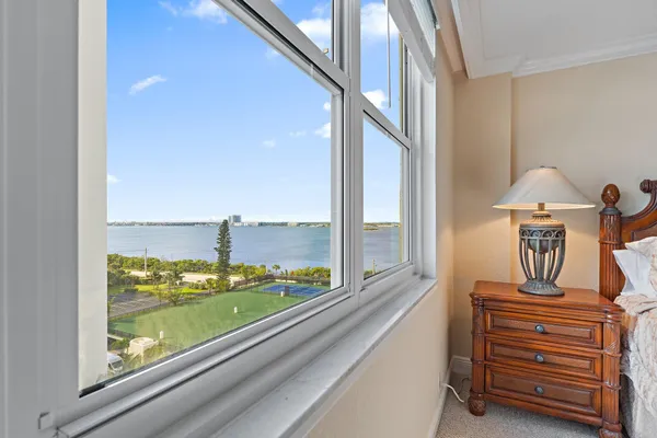 a kitchen with a dining table chairs and white cabinets
