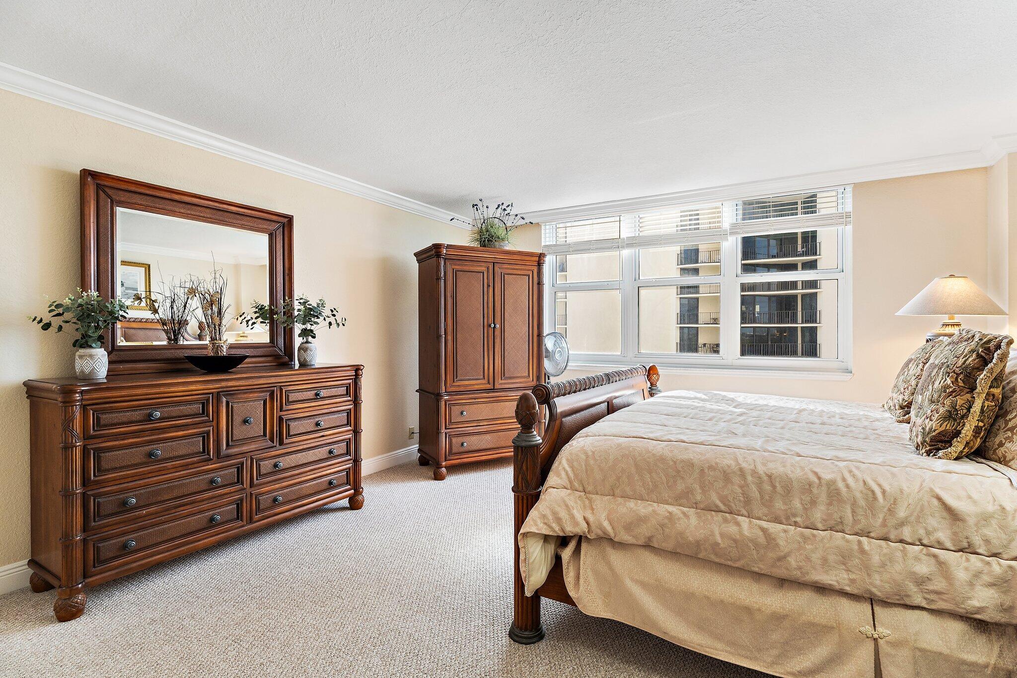 Undisclosed Address Singer Island, FL 33404 - Photo 24 of 77 a bedroom with a bed and a dresser