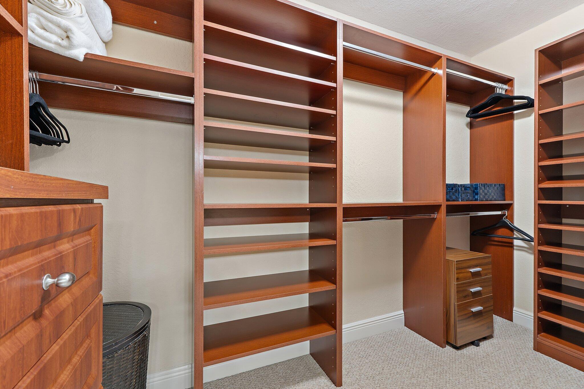 Undisclosed Address Singer Island, FL 33404 - Photo 26 of 77 a view of walk in closet with clothes and shoes