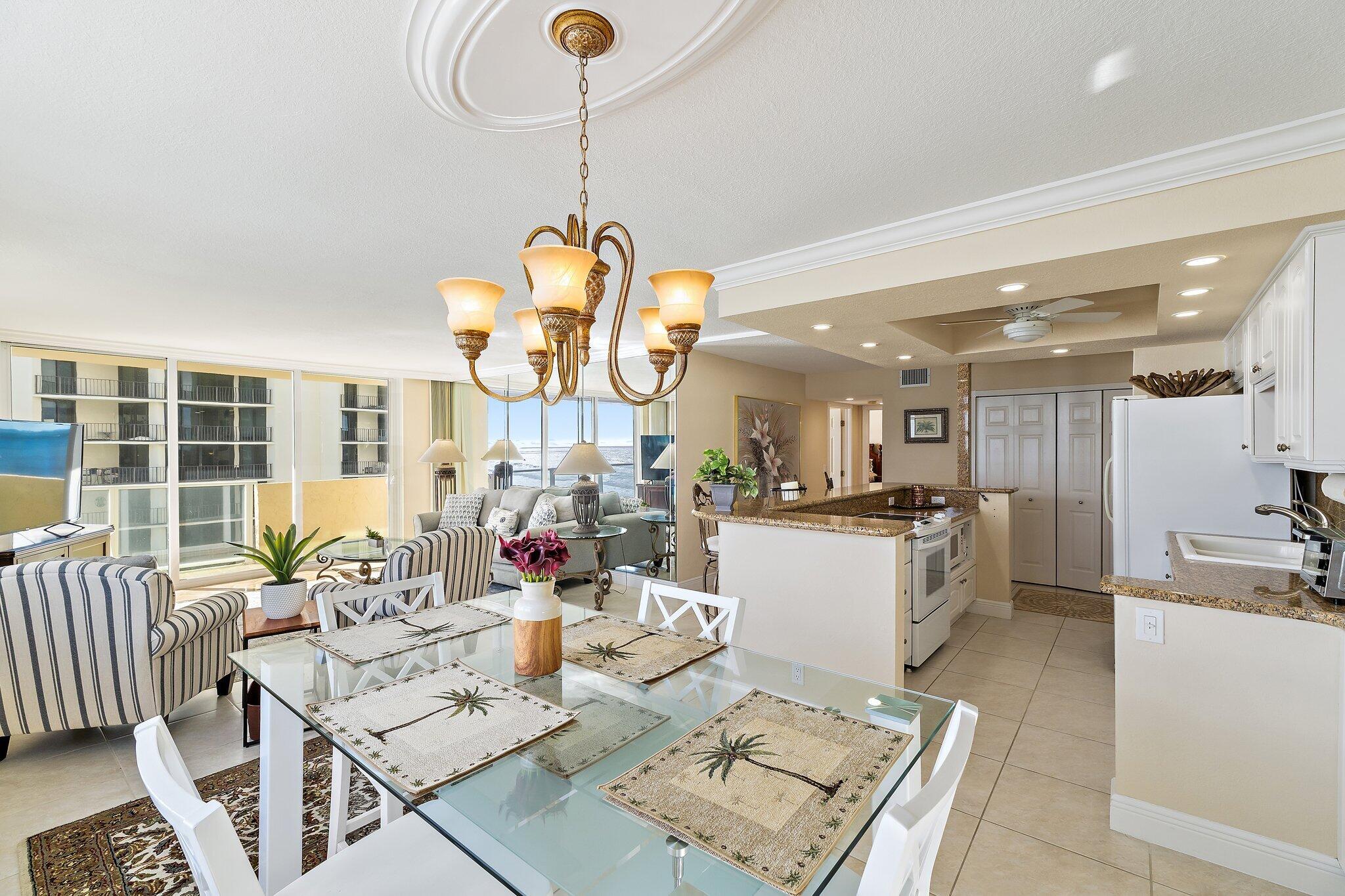Undisclosed Address Singer Island, FL 33404 - Photo 33 of 77 a living room with furniture and a chandelier