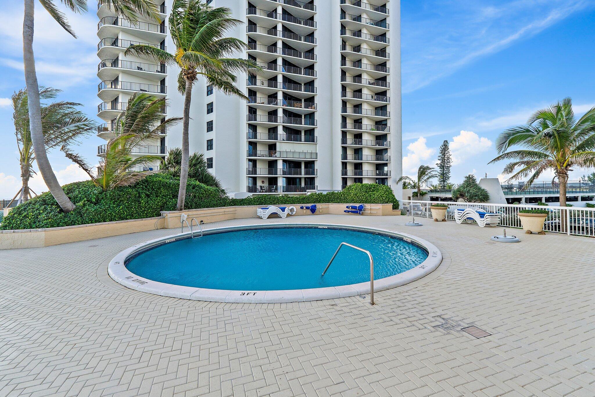 Undisclosed Address Singer Island, FL 33404 - Photo 44 of 77 a view of a swimming pool with outdoor seating