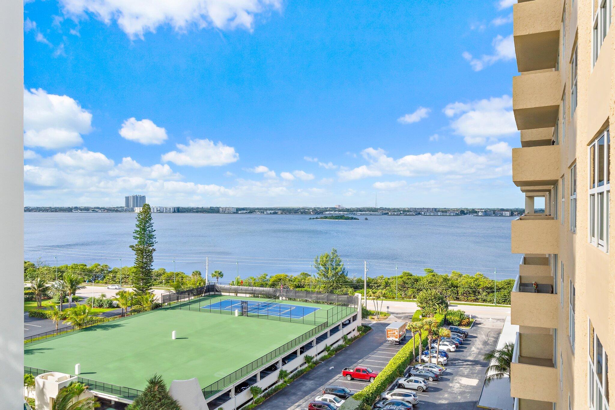 Undisclosed Address Singer Island, FL 33404 - Photo 61 of 77 a view of a lake with a big yard