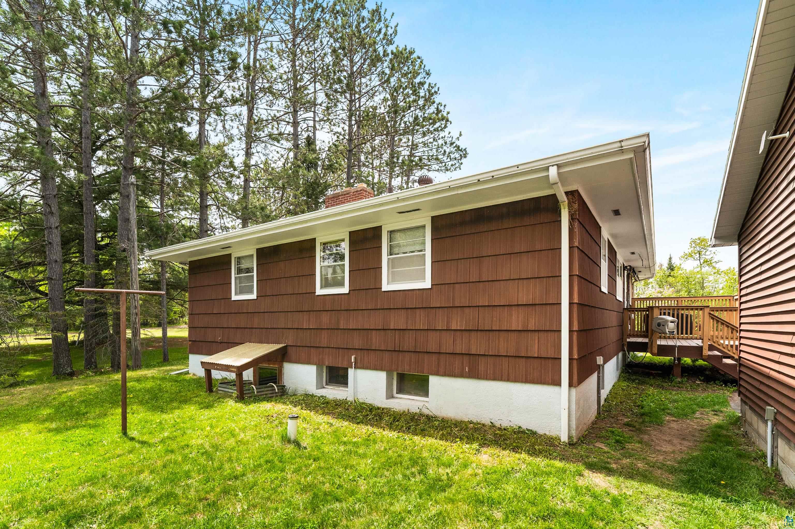 4808 Midway Road Duluth, MN 55811 - Photo 48 of 57 Property exterior featuring brown shingle siding and a white trim