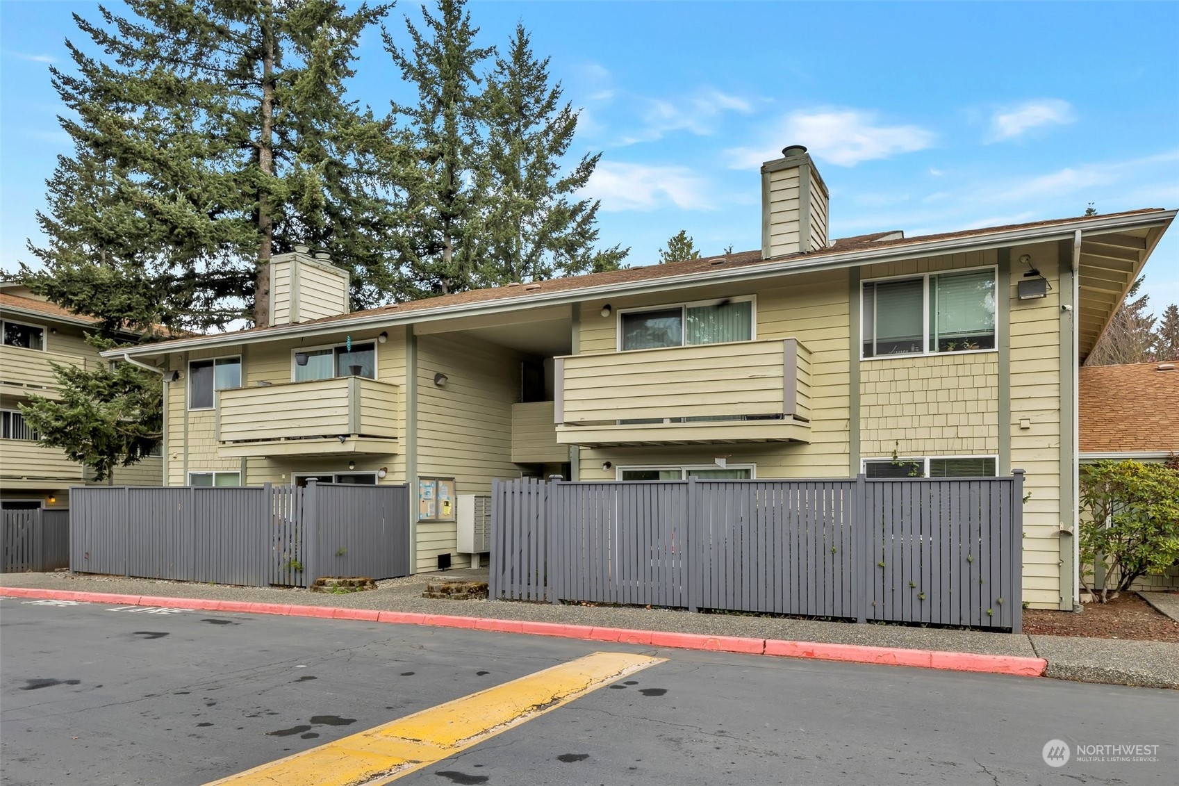 1150 Sunset Boulevard Northeast, Unit 118 Renton, WA 98056 - Photo 1 of 12 a front view of a house with a garage