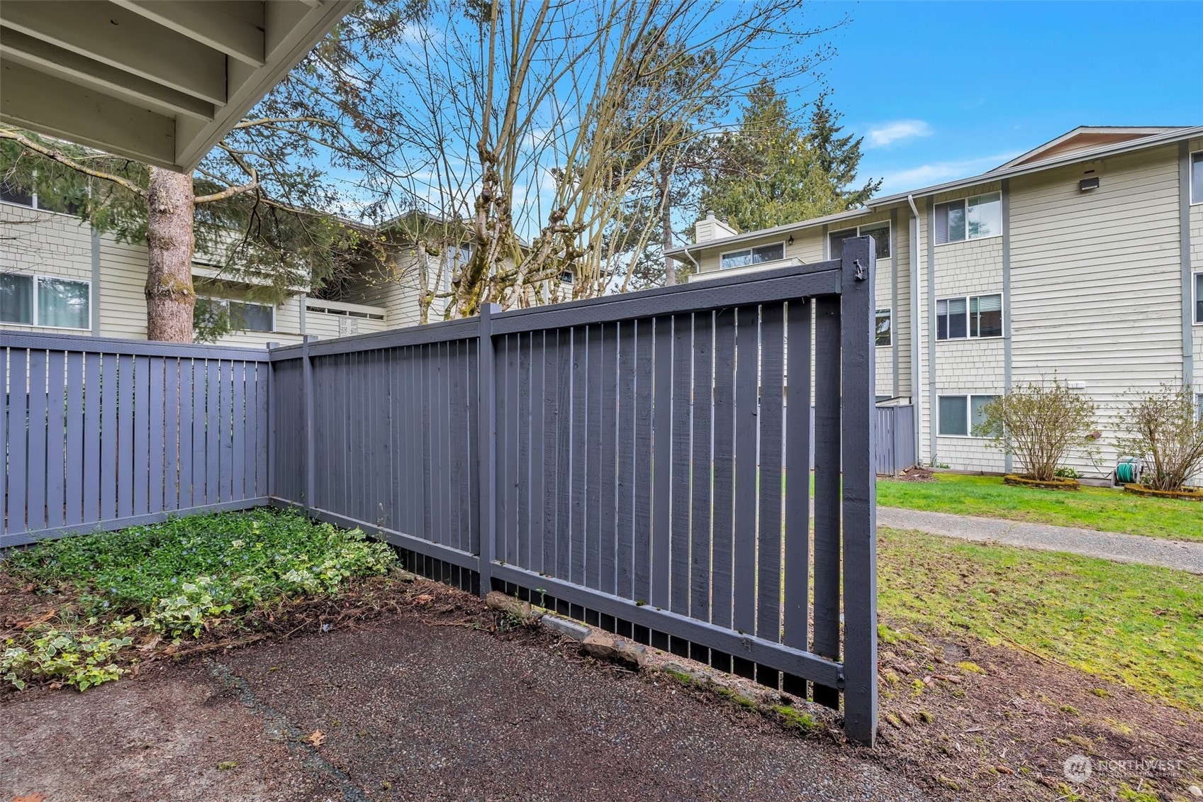 1150 Sunset Boulevard Northeast, Unit 118 Renton, WA 98056 - Photo 11 of 12 a view of a backyard with a garden