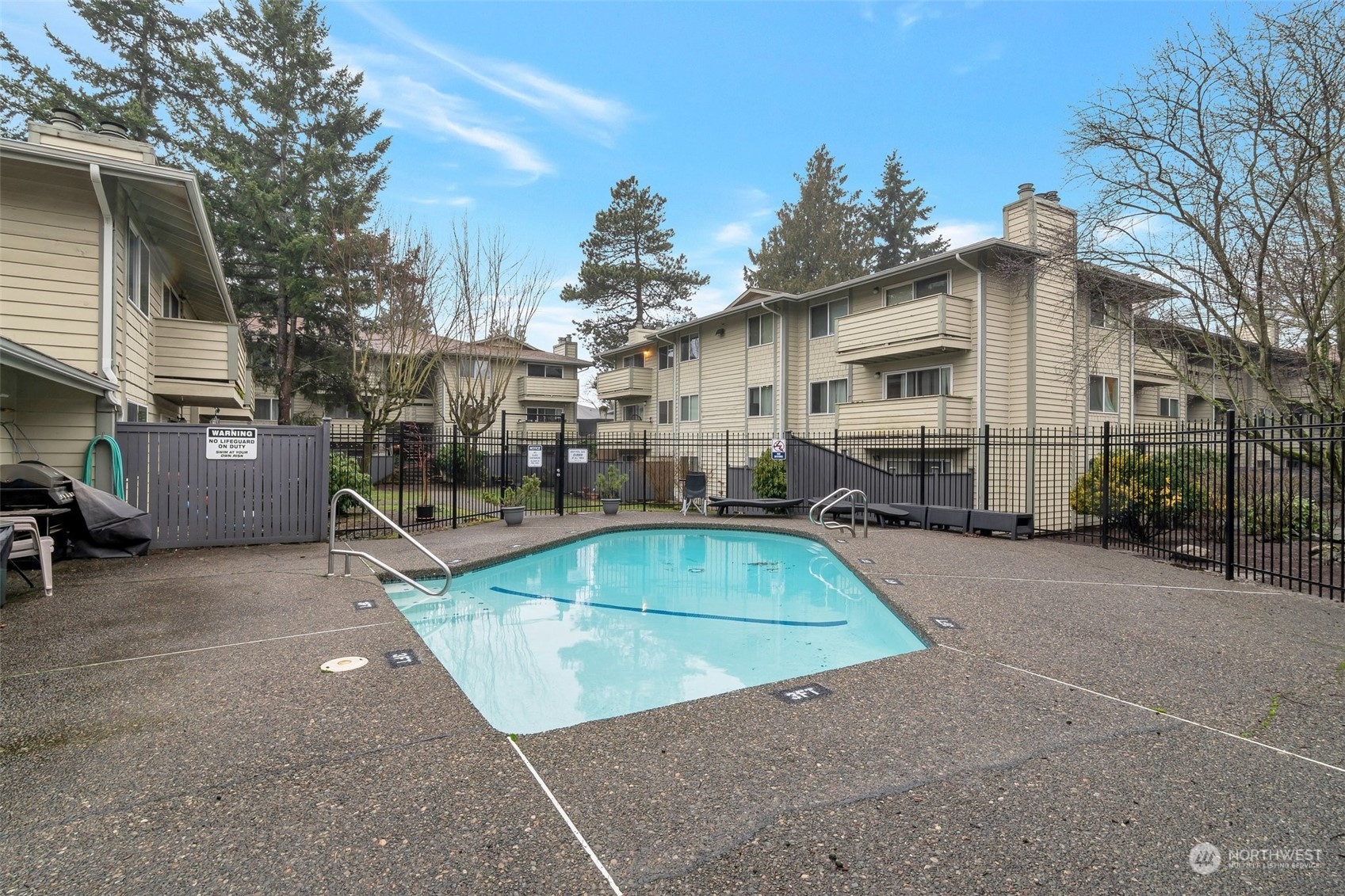 1150 Sunset Boulevard Northeast, Unit 118 Renton, WA 98056 - Photo 12 of 12 a view of a house with basketball court