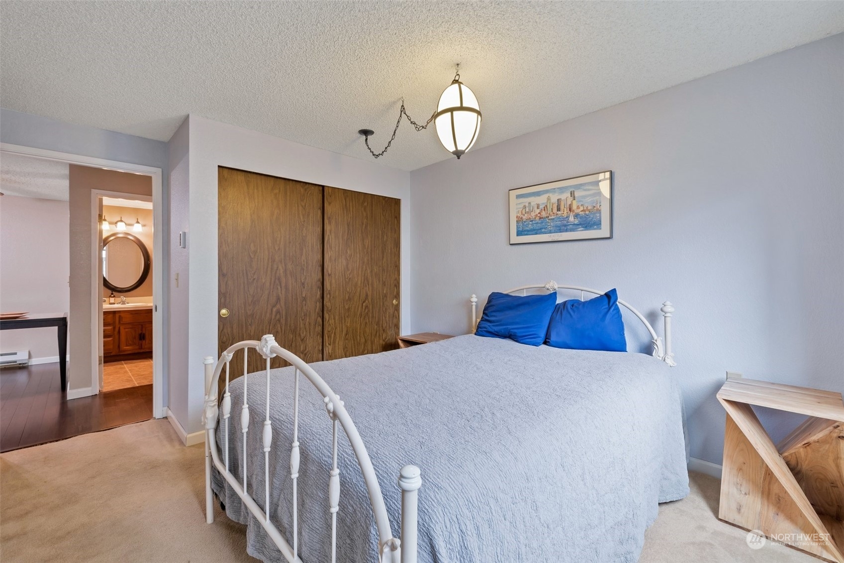 1150 Sunset Boulevard Northeast, Unit 118 Renton, WA 98056 - Photo 7 of 12 a bed room with a bed and a lamp