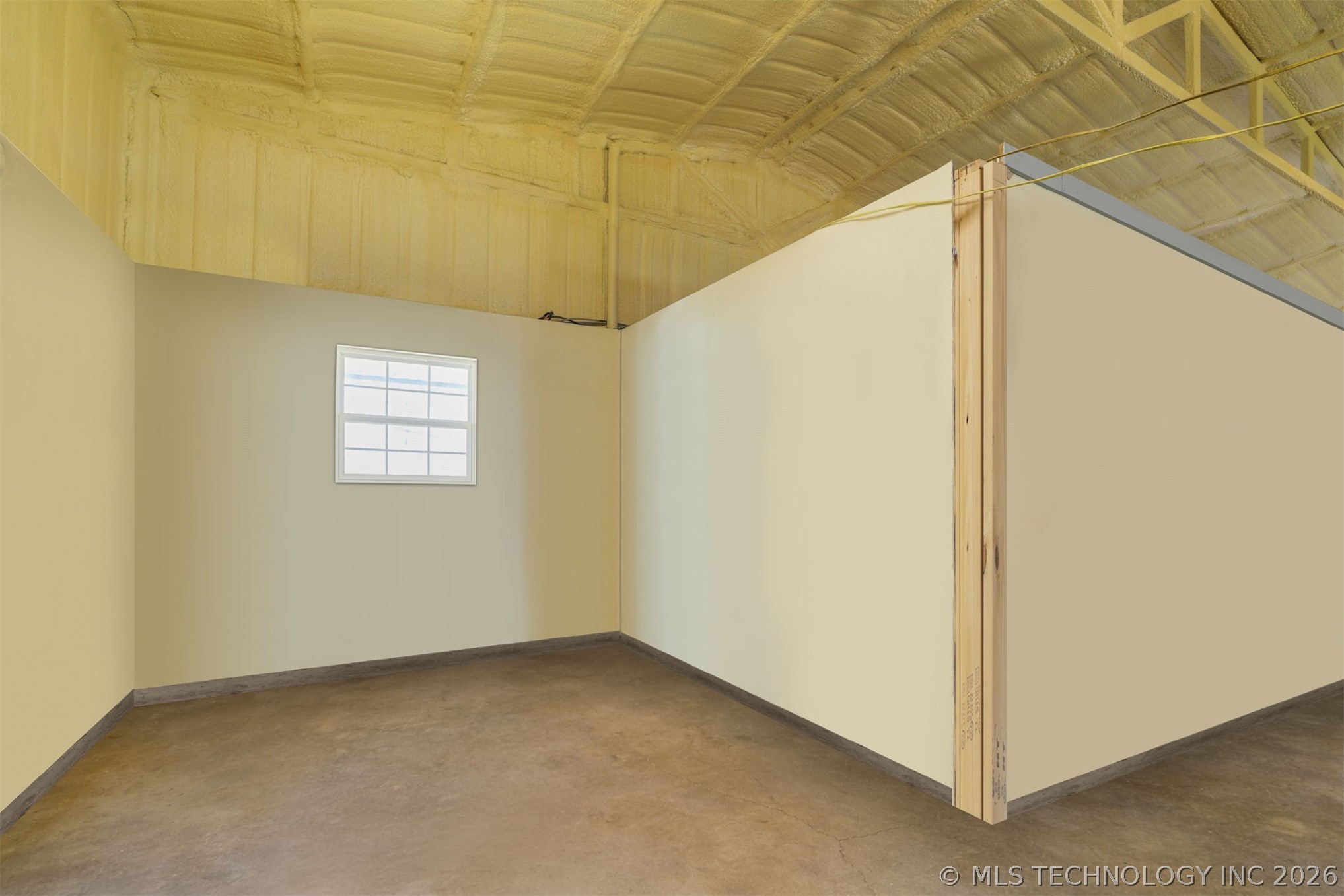 3565 Sawmill Road Caddo, OK 74729 - Photo 16 of 32 Wall-mounted window, concrete flooring, exposed ceiling insulation, wood framing