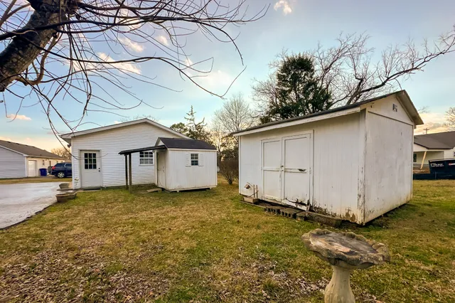 a kitchen with stainless steel appliances granite countertop a refrigerator stove and sink