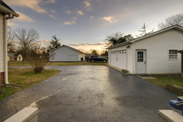 a kitchen that has a table and chairs in it