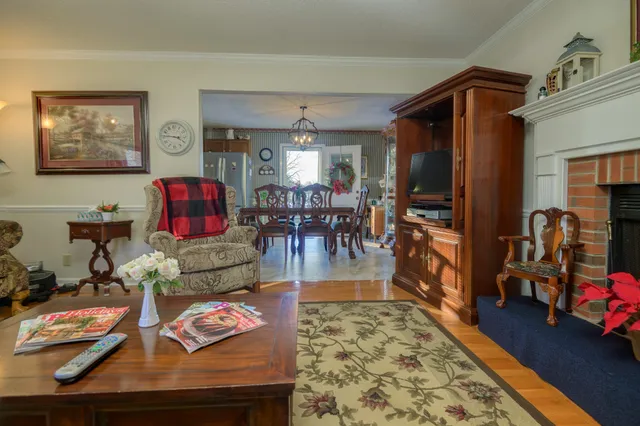 a bedroom with a bed a dresser and mirror