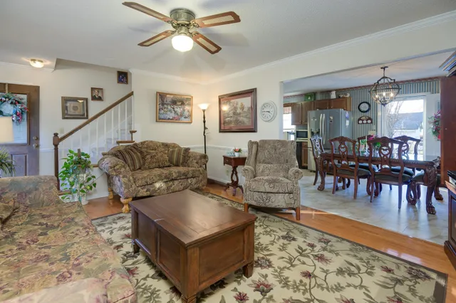 a bedroom with a bed and dresser with mirror