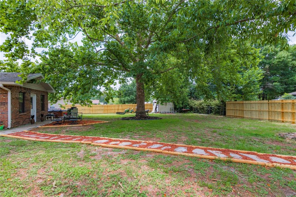 126 Southwest Mockingbird Way Lake City, FL 32024 - Photo 14 of 37 a view of backyard with green space and porch